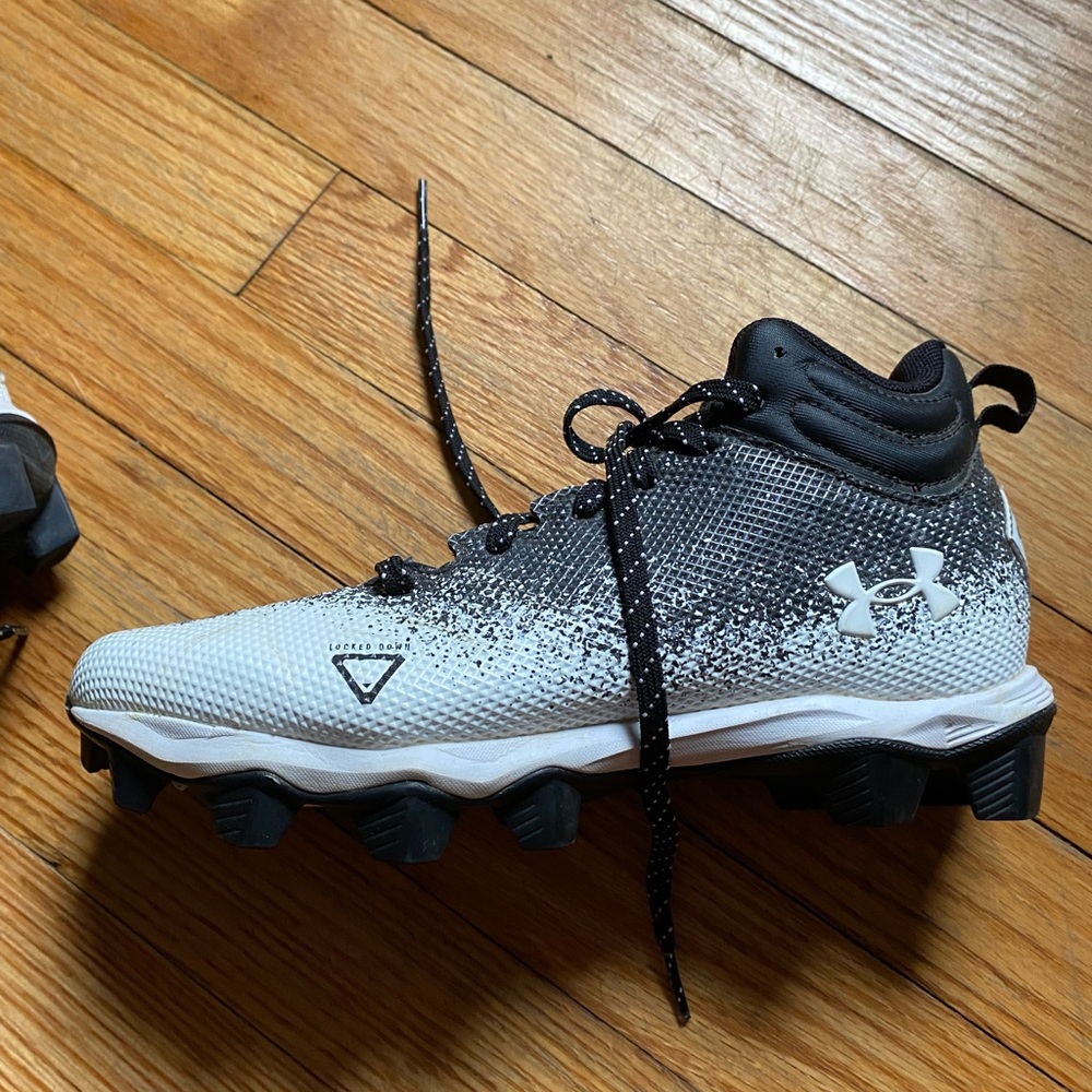 Youth under armor football cleats.